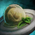 Spherified Oyster Soup with Mint Garnish.png