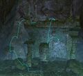 From the middle platform, jump up the south side (left in image) to the top of the room. From there, jump down onto the pillar and onto the edge of the broken wall.